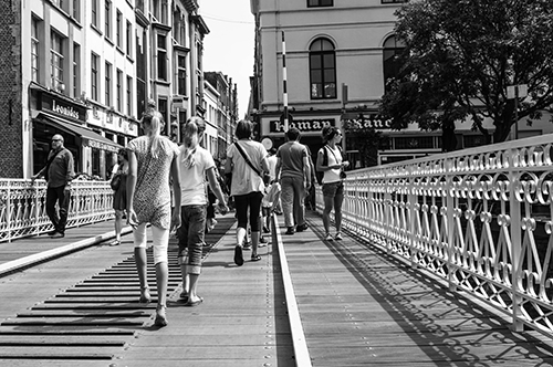 Walking over the bridge - black and white - Ghent